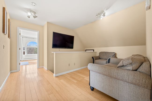 upstair tv nook near the stairs | Image 36