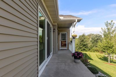 The front entrance has a paved walk between the home and the yard/garden. | Image 2