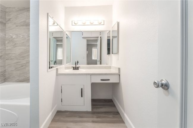 Full bathroom with vanity and wood finished floors | Image 19