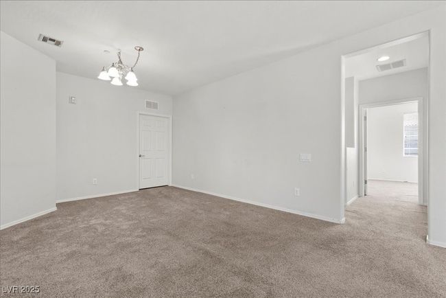 Unfurnished room with carpet and a chandelier | Image 15