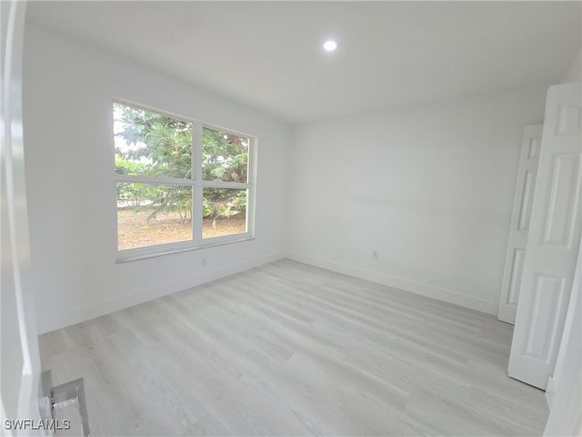 Unfurnished room with baseboards, light wood-style flooring, and recessed lighting | Image 39