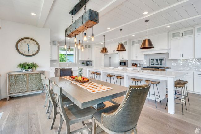 Dining space with beamed ceiling, light wood-style floors, and recessed lighting | Image 19