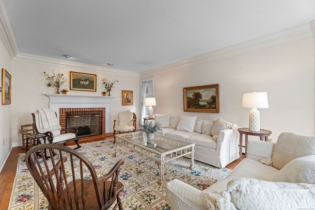 Wood burning fireplace in the living room | Image 12