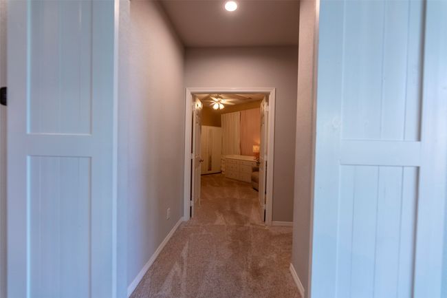 Hall featuring carpet floors and baseboards | Image 24