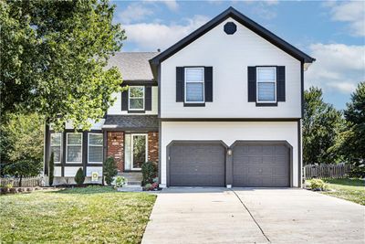 View of front of home with a garage | Image 1