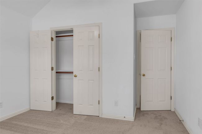 Unfurnished bedroom featuring carpet floors and a closet | Image 25