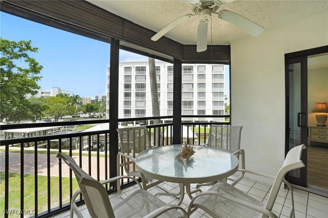 Balcony with a ceiling fan and a city view | Image 32