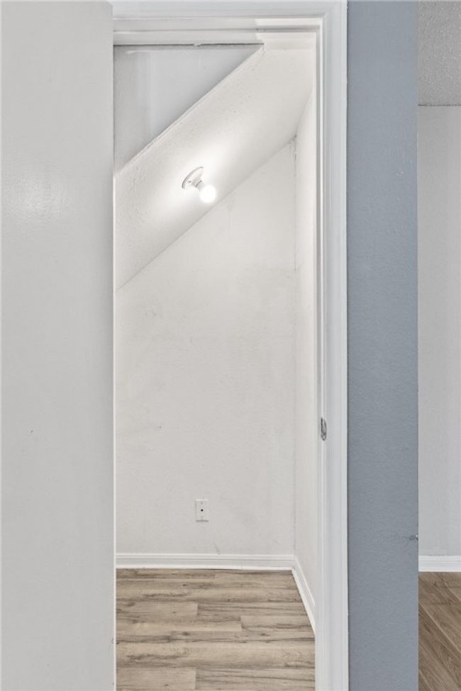 Storage closet under the stairs | Image 13
