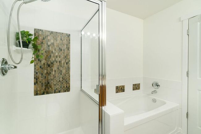 Full bathroom with a garden tub and a shower stall | Image 29