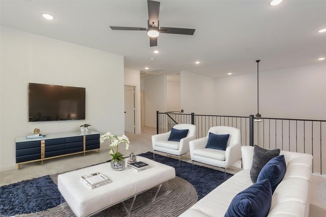 Living area featuring carpet flooring, a ceiling fan, attic access, and recessed lighting | Image 16