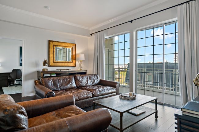 Living room with crown molding, baseboards, and wood finished floors | Image 5