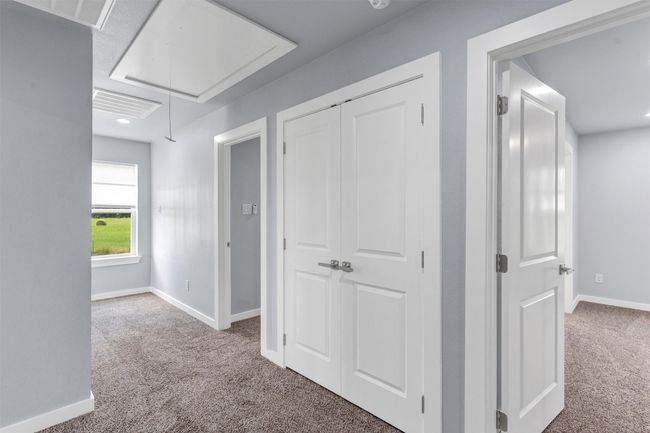 Hallway featuring attic access and carpet flooring | Image 23