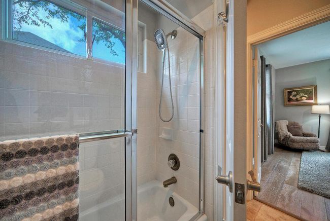 Full bath featuring shower / bath combination with glass door | Image 24