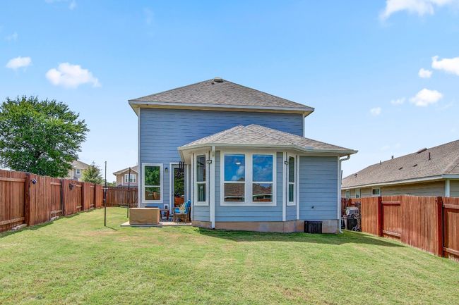 Back of property featuring a fenced backyard and roof with shingles | Image 39