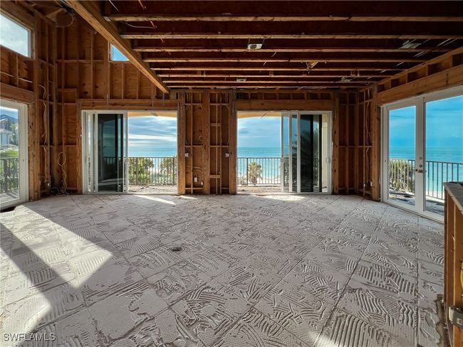Miscellaneous room featuring a wealth of natural light and a water view | Image 35