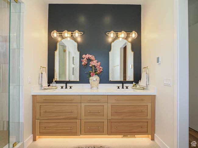 Full bath featuring double vanity and an enclosed shower | Image 54