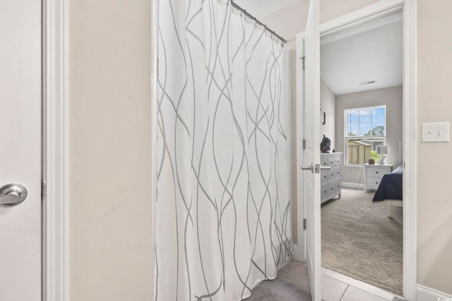 Full bath featuring baseboards and a shower with shower curtain | Image 19