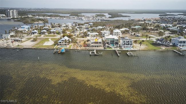 Aerial view of residential area with a nearby body of water | Image 32