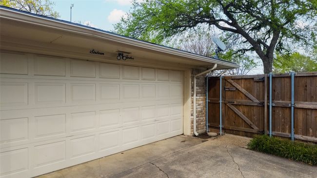 Garage featuring driveway and a gate | Image 9