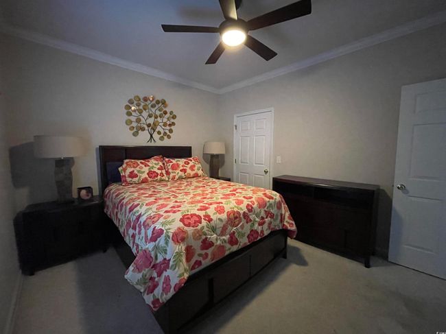 Third Bedroom has Xtra Large Closet, Crown Molding, Berber Carpeting and Ceiling Fan. | Image 23