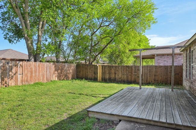 View of yard with a fenced backyard and a deck | Image 29