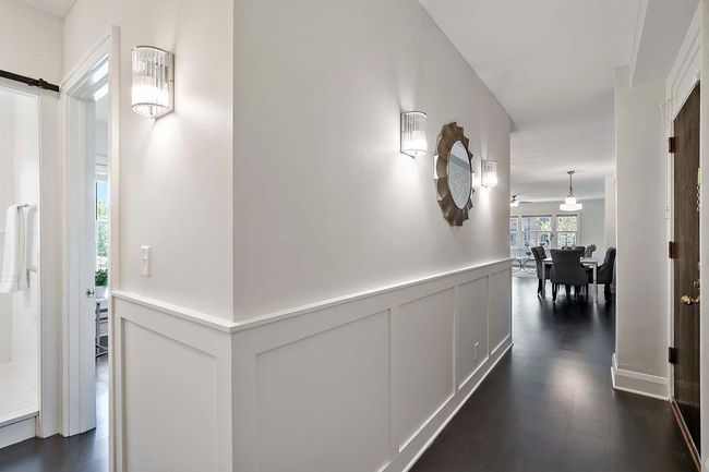 The entryway has beautiful sconces. | Image 27