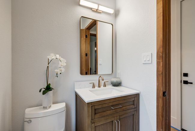 Half bathroom featuring vanity and toilet | Image 20