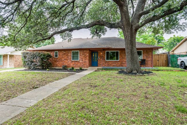 Ranch-style house with brick siding and roof with shingles | Image 5