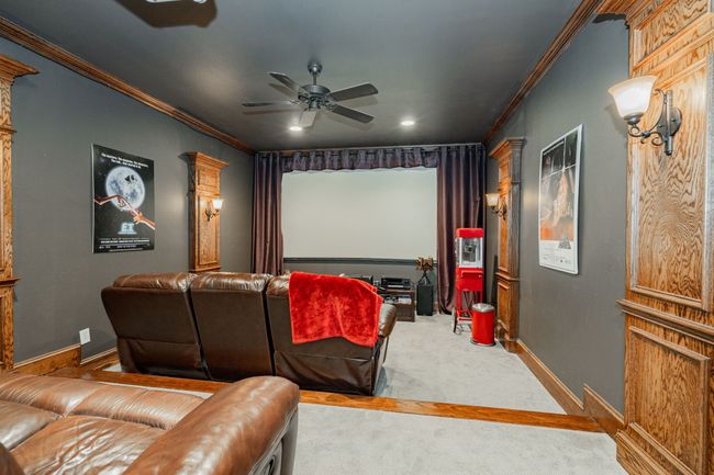 Home theater room featuring recessed lighting, ornamental molding, carpet floors, baseboards, and ceiling fan | Image 29