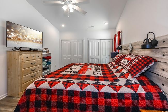 Bedroom featuring two closets and a ceiling fan | Image 18