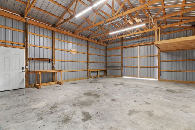 Garage featuring metal wall | Image 35