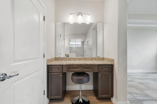 Bathroom featuring vanity and baseboards | Image 16