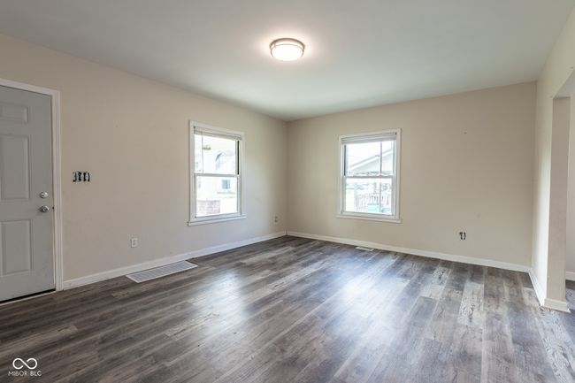 spare room with visible vents, dark wood finished floors, and baseboards | Image 21