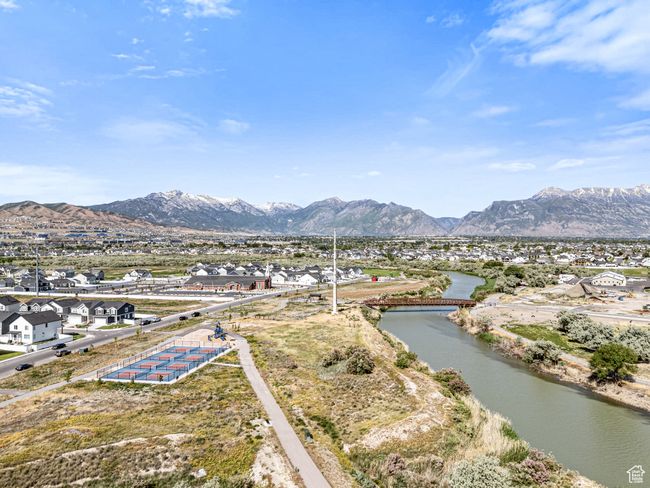 View of mountain backdrop with a large body of water and nearby suburban area | Image 34