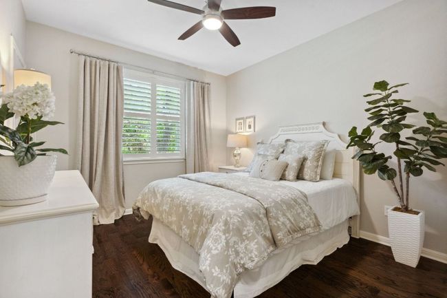 One of two perfectly sized secondary bedrooms upstairs, this room comes with wood floors. | Image 26