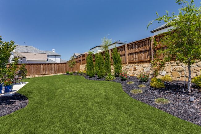 View of fenced backyard | Image 40