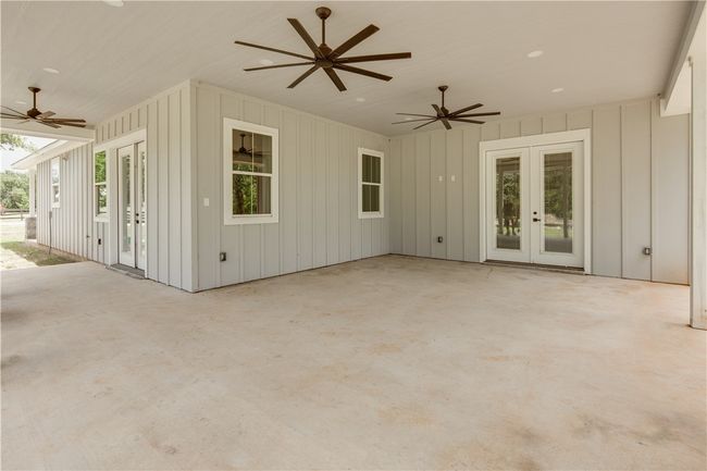 View of patio / terrace featuring french doors and ceiling fan | Image 21