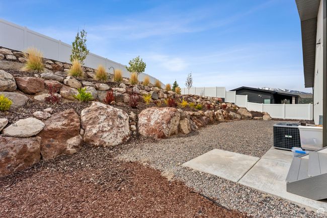 View of yard featuring central AC and fence | Image 57