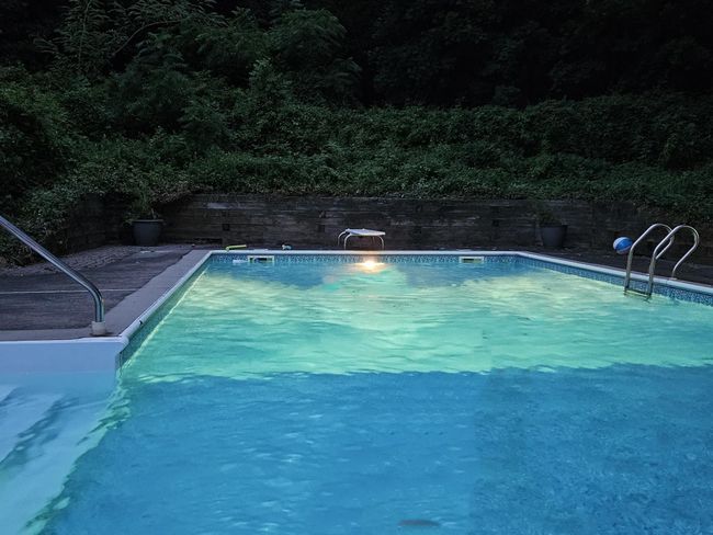 View of swimming pool with a diving board | Image 34