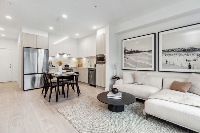 Living area with recessed lighting and light wood finished floors | Image 9