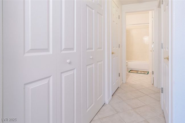 Corridor with light tile patterned floors | Image 31