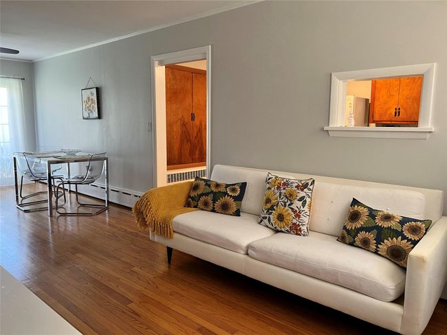 Living area featuring wood finished floors and ornamental molding | Image 41