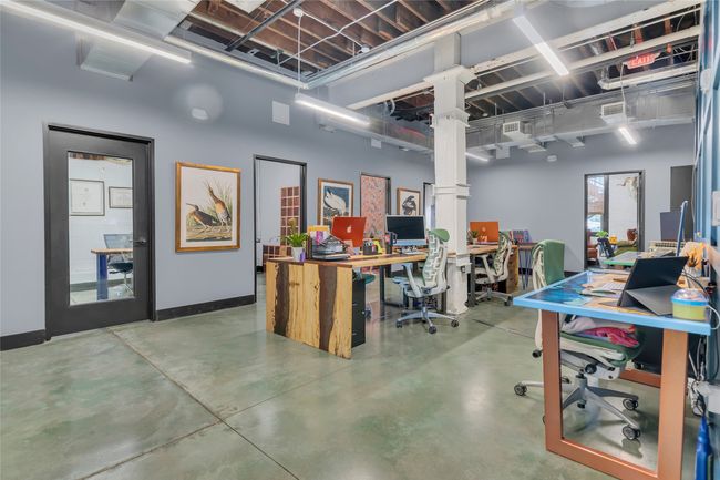 Home office featuring concrete flooring | Image 10