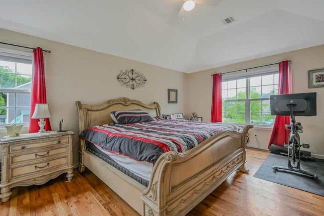 Large Primary Bedroom With Wood Flooring, Walk In Closet & Full Bathroom | Image 16
