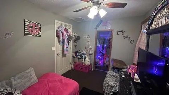 Bedroom featuring ceiling fan | Image 21