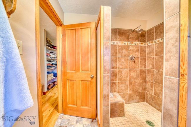 Primary ensuite bathroom with walk-in tiled shower | Image 21