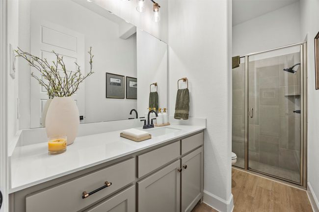 Full bathroom featuring vanity, a shower stall, and wood finished floors | Image 30