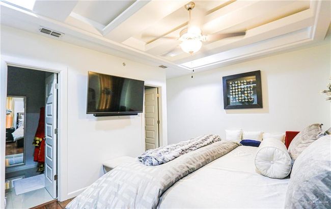 Bedroom featuring hardwood / wood-style floors and ceiling fan | Image 21
