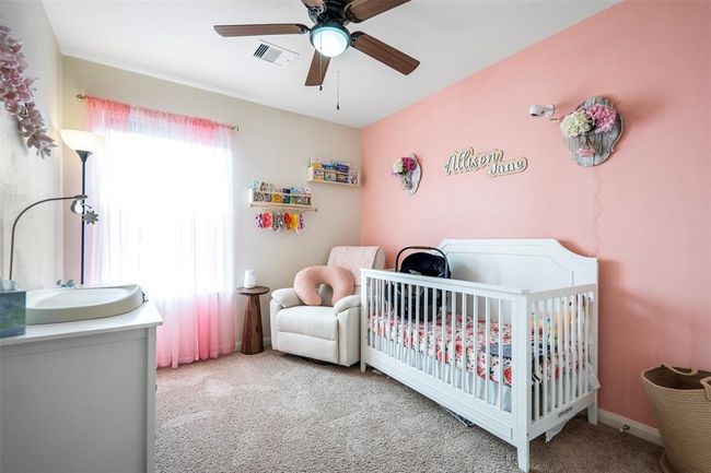 Bedroom 1 outlooking street view with ceiling fans | Image 19