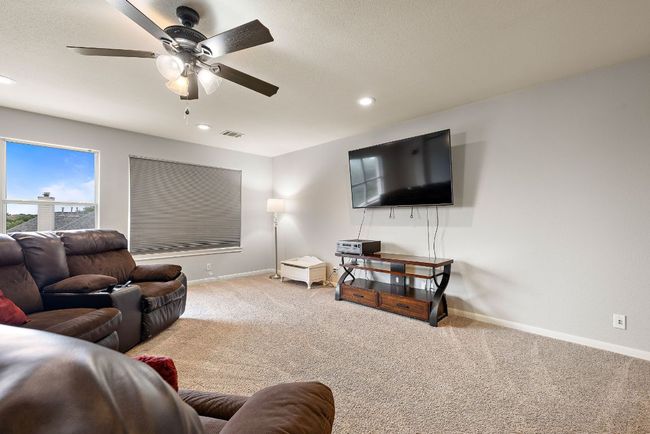A huge media room/game room is separate from the bonus room and offers an extra living space! | Image 31